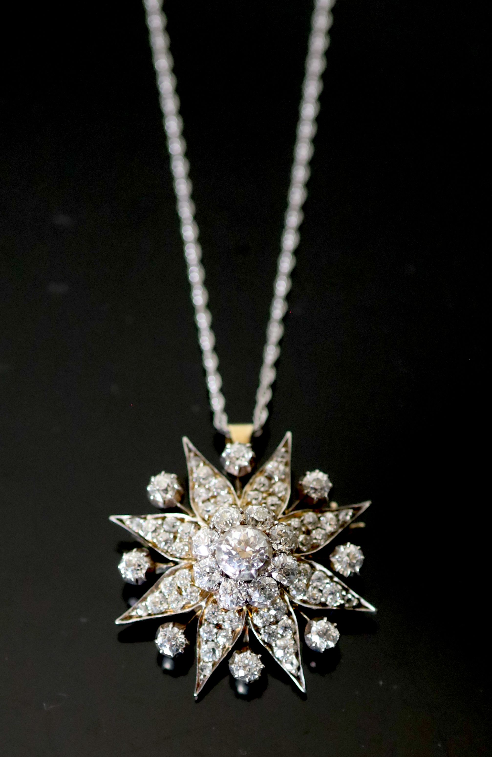 A Victorian, gold, silver and diamond cluster set star pendant brooch,